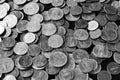 American cents on an old black wooden surface close-up. Monochrome money background Royalty Free Stock Photo