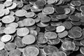 American cents on an old black wooden surface close-up. Monochrome money background Royalty Free Stock Photo