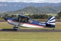 American Champion 8KCAB single engine light aircraft VH-FKM at Illawarra Regional Airport. Royalty Free Stock Photo