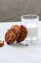 American chocolate chip cookies with glass of milk on a white st Royalty Free Stock Photo