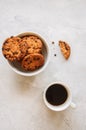 American chocolate chip cookies in a white bowl cup of coffee on Royalty Free Stock Photo