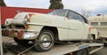 1951 American Chrysler Newport car on a recovery truck being taken for restoration