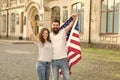 American citizenship is a very precious possession. Bearded man and sensual woman holding american flag on July 4th