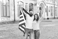 American citizenship is a very precious possession. Bearded man and sensual woman holding american flag on July 4th