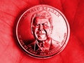 The American coin lies in the palm. 1 dollar coin with the portrait of President Ronald Reagan. Close-up. The illustration is Royalty Free Stock Photo