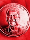 The American coin lies in the palm. 1 dollar coin with the portrait of President Ronald Reagan. Close-up. Vertical illustration is Royalty Free Stock Photo