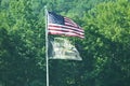 American and Combat Veteren flags flying on pole Royalty Free Stock Photo