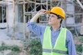 American construction engineer male smart confident looking high for proud at work