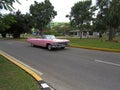 American convertible vintage cars parked on the main street in Varadero Cuba