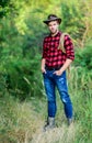 American cowboy. Lasso tied wrapped. Western life. Man cowboy nature background. Man wearing hat hold rope. Ranch owner