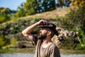 American cowboy. Leather Cowboy Hat. Portrait of young man wearing cowboy hat. Cowboys in hat. Handsome bearded macho Royalty Free Stock Photo