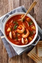 American cuisine: Manhattan chowder soup closeup. Vertical