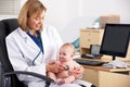 American doctor examining baby Royalty Free Stock Photo