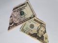 American dollar bills on the broken sheet of paper Royalty Free Stock Photo