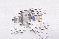 American dollar hidden under puzzle pieces