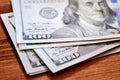 American dollars banknotes on wooden table