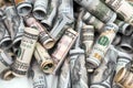 Many dollar bills are rolled into tubes