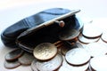 American dollars in a coin purse on a white background. Royalty Free Stock Photo