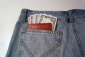 American dollars and foreign passport in the jeans pocket. Royalty Free Stock Photo