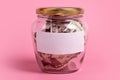 American dollars in glass money jar with blank label, financial, saving.Money box with empty sticky note paper. Jar full of cash, Royalty Free Stock Photo