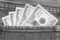 American dollars sticking out of the blue jeans pocket. Business concept exchange. Royalty Free Stock Photo