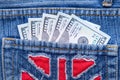 American dollars sticking out of the blue jeans pocket. Business concept exchange. Royalty Free Stock Photo