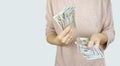 American dollars or US dollars: hand counting one hundred American money or 100 USD Royalty Free Stock Photo