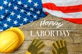 American employment in construction, Labor day and industrial work concept with close up on a yellow hard hat and safety gloves Royalty Free Stock Photo