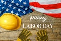 American employment in construction, Labor day and industrial work concept with close up on a yellow hard hat and safety gloves Royalty Free Stock Photo