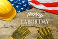 American employment in construction, Labor day and industrial work concept with close up on a yellow hard hat and safety gloves Royalty Free Stock Photo