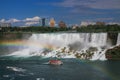 American Falls of Nagara Falls with a rainbow and a tour boat under the rainbow Royalty Free Stock Photo