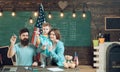 American family at desk with son making paper planes. Homeschooling concept. Kid with parents in classroom with usa flag Royalty Free Stock Photo