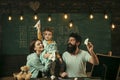 American family at desk with son play with paper planes. Homeschooling concept. Kid with parents in classroom with usa Royalty Free Stock Photo