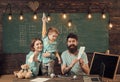 American family at desk with son play with paper planes. Homeschooling concept. Parents teaching son american traditions Royalty Free Stock Photo