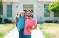 American father and son walking trough school park. Portrait of teacher and happy pupil. Royalty Free Stock Photo