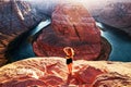 American female tourist on Grand canyon. Travel Lifestyle success concept. Young Woman enjoying view of Horseshoe bend. Royalty Free Stock Photo