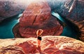 American female tourist on Grand canyon. Travel Lifestyle success concept. Young Woman enjoying view of Horseshoe bend. Royalty Free Stock Photo