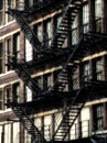 American fire escapes on an old building at Chicago Center - Sepia Glow Artistic Effect Royalty Free Stock Photo