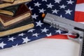 American firearm handgun lying on US flag with school shooting gun Royalty Free Stock Photo