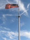 American Flag against a Blue Sky Royalty Free Stock Photo