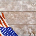 American Flag against a wood background with copy space. Royalty Free Stock Photo