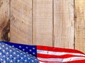 American Flag against a wood background with copy space. Royalty Free Stock Photo