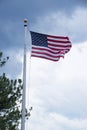 American flag also called the Stars and Stripes or Old Glory flying at full mast on flag pole in United States of America