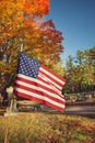 American flag in autumn cemetery Royalty Free Stock Photo