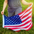 American flag and Black Lives Matter text, slogan on a piece of paper supporting African Americans in the United States Royalty Free Stock Photo