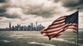 American flag blowing in the wind. On the left in the picture. New York in the background. Royalty Free Stock Photo