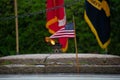 American flag blows in the wind against a backdrop of other flags, symbolizing patriotism and pride Royalty Free Stock Photo