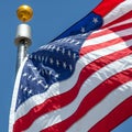 American flag blows in the wind with flag pole Royalty Free Stock Photo