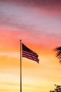 American flag blows in the wind at sunrise Royalty Free Stock Photo