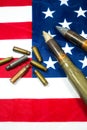 American flag with bullets, shells, cartridges and projectiles on it. Lend-Lease concept.  Army concept. Sales of weapons and Royalty Free Stock Photo
